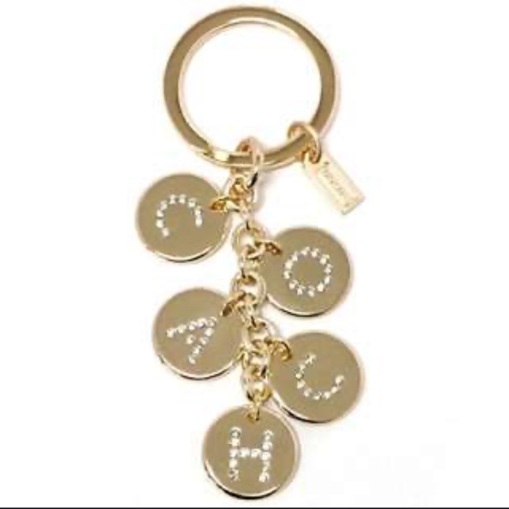 Coach gold tone charm keychain